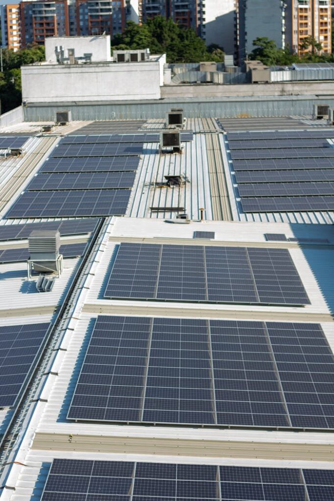 Aerial view of solar panels on an urban rooftop in Valle del Cauca, Colombia.
