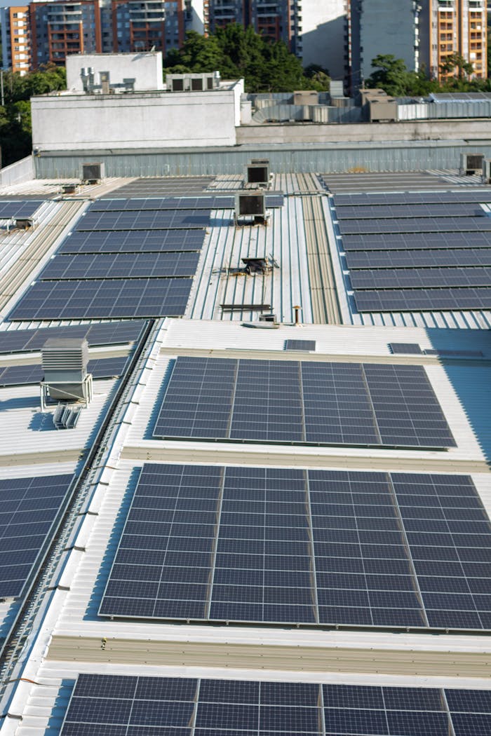 Aerial view of solar panels on an urban rooftop in Valle del Cauca, Colombia.